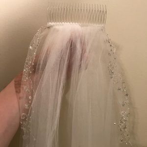 Long white veil with beading on edges